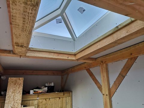 Interior view of a roof lantern set into exposed timber framing