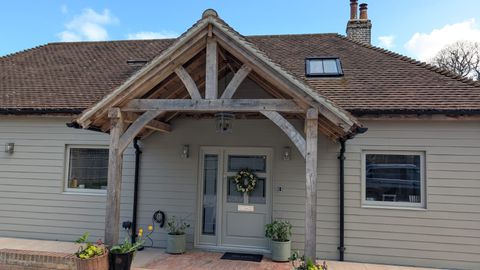 Finished oak porch entrance on a renovated family home